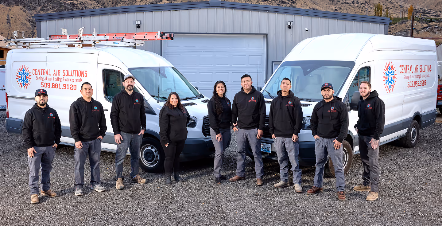 The Central Air Solutions team in front of their service vans